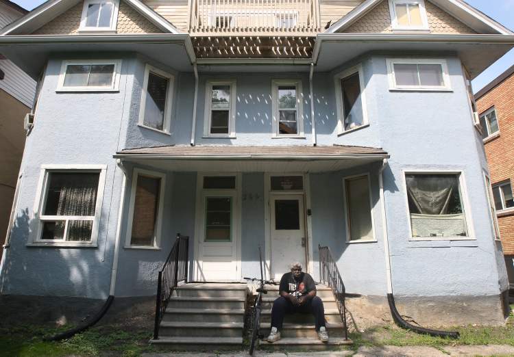 JOE BRYKSA / WINNIPEG FREE PRESS
Caretaker Albert believes he needs to sit on porch of the Furby Street rooming house where he works so everyone knows he's around.