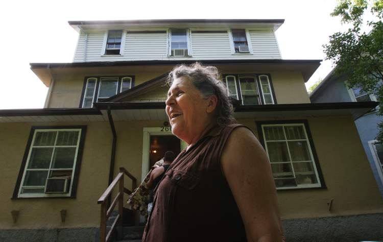 JOE BRYKSA / WINNIPEG FREE PRESS
Cathy outside the Furby Street rooming house she calls home.