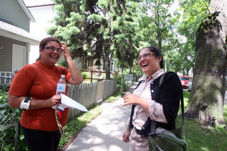 JOE BRYKSA / WINNIPEG FREE PRESS
Spence Neighborhood Association workers Isabel Jerez (right) and Mary Burton on Spence Street.