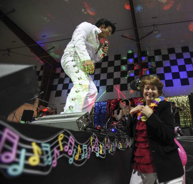 JESSICA BURTNICK / WINNIPEG FREE PRESS
An audience member is glowing after Dave Stiglmayr places a lei around her neck. Elvis Presley — Aloha from Gimli.
