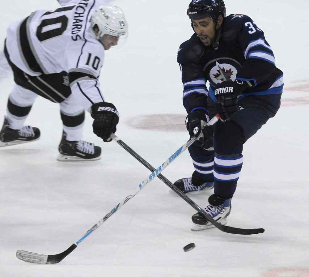 MIKE DEAL / WINNIPEG FREE PRESS
Winnipeg Jets' Dustin Byfuglien (33) stickhandles the puck past Los Angeles Kings' Mike Richards (10) in the second period.