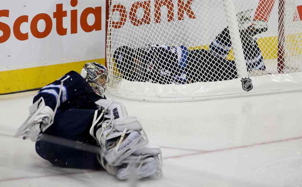 TREVOR HAGAN / WINNIPEG FREE PRESS
Winnipeg Jets' Mark Stuart ends up in the Jets' net after colliding with goaltender Ondrej Pavelec during the third period.