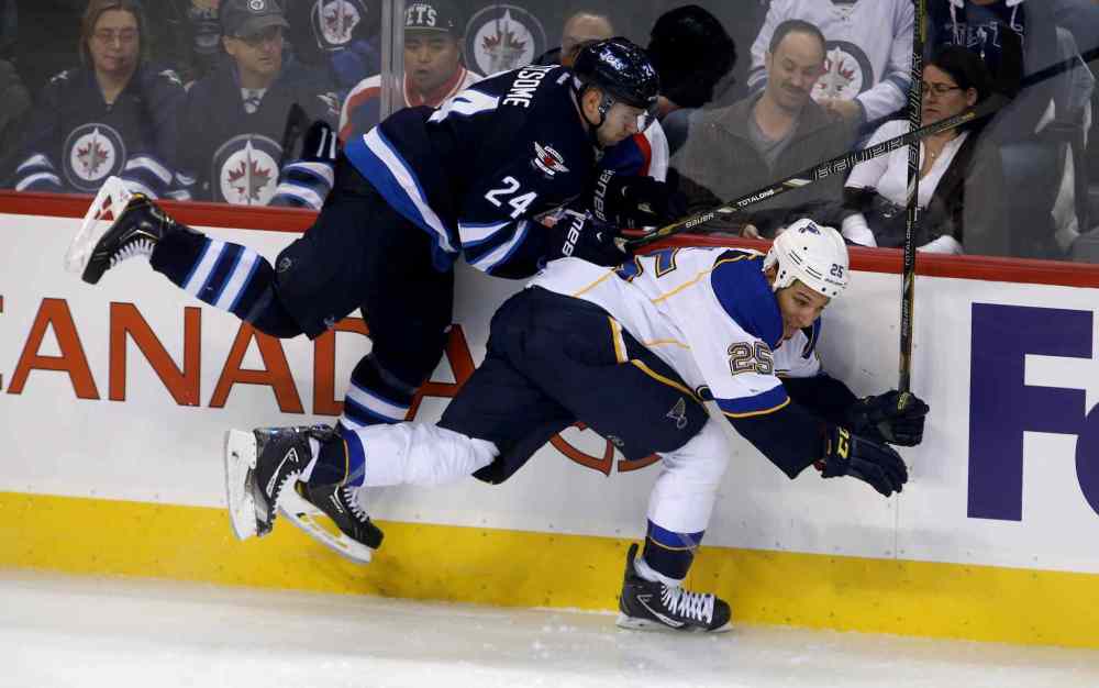 TREVOR HAGAN / WINNIPEG FREE PRESS
Winnipeg Jets defenceman Grant Clitsome collides with St. Louis Blues' Chris Stewart during the third period.