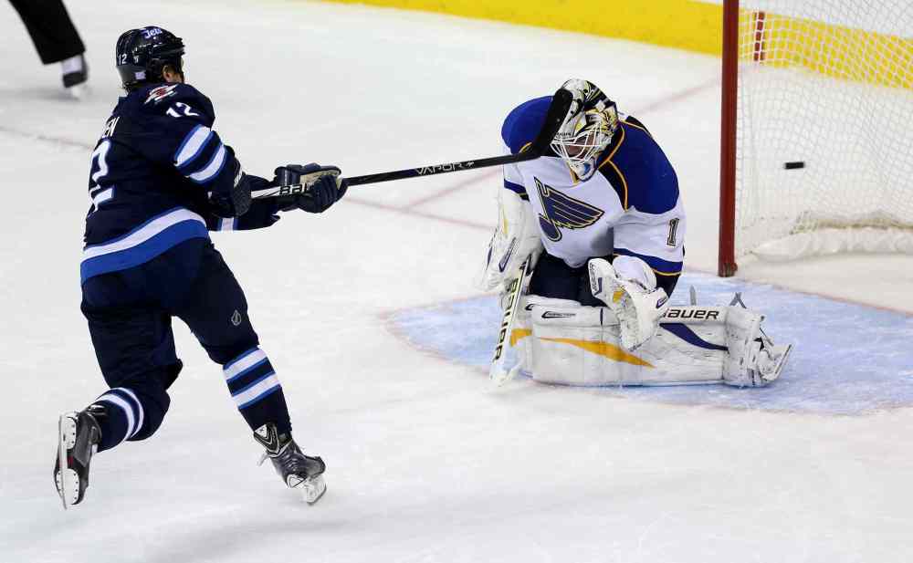 TREVOR HAGAN / WINNIPEG FREE PRESS
Olli Jokinen scores the game-winning goal in the shootout.