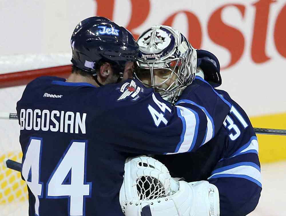 TREVOR HAGAN / WINNIPEG FREE PRESS
Zach Bogosian (left) celebrates with Ondrej Pavelec after the shootout.