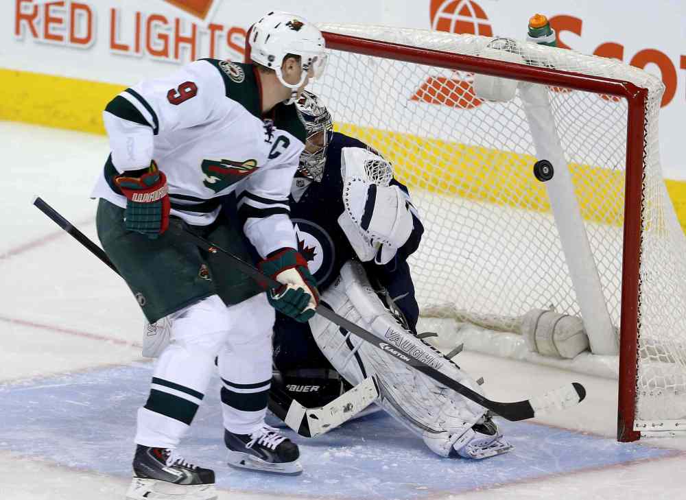 TREVOR HAGAN / WINNIPEG FREE PRESS
Minnesota Wild's Mikko Koivu beats Winnipeg Jets goaltender Ondrej Pavelec during the shootout.