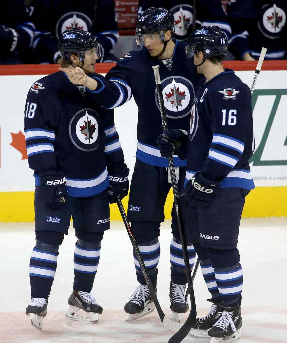 TREVOR HAGAN / WINNIPEG FREE PRESS
Winnipeg Jets forwards Bryan Little (left), Blake Wheeler (centre) and Andrew Ladd talking during the third period.