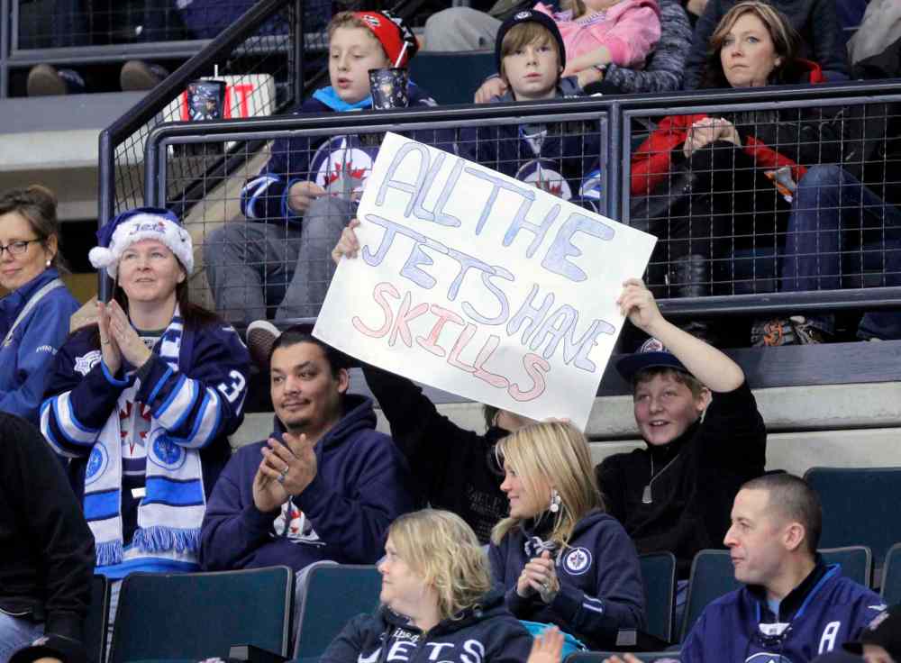 Boris Minkevich / Winnipeg Free Press
Fans hold up a sign at the skills competition.
