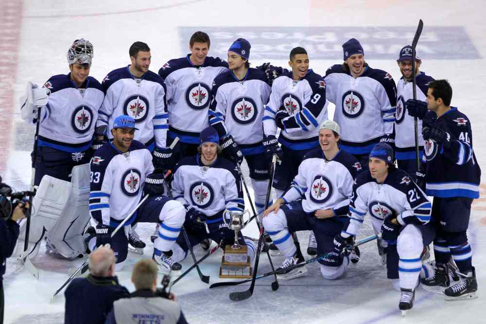 Boris Minkevich / Winnipeg Free Press
Devin Setoguchi (right) of Team Blue crashes Team White's party.