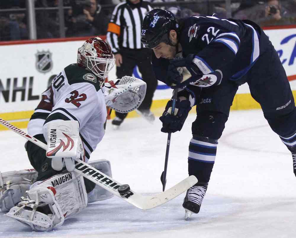 JOE BRYKSA / WINNIPEG FREE PRESS
Winnipeg Jets forward Chris Thorburn is stymied by Minnesota Wild goaltender Niklas Backstrom during the second period.