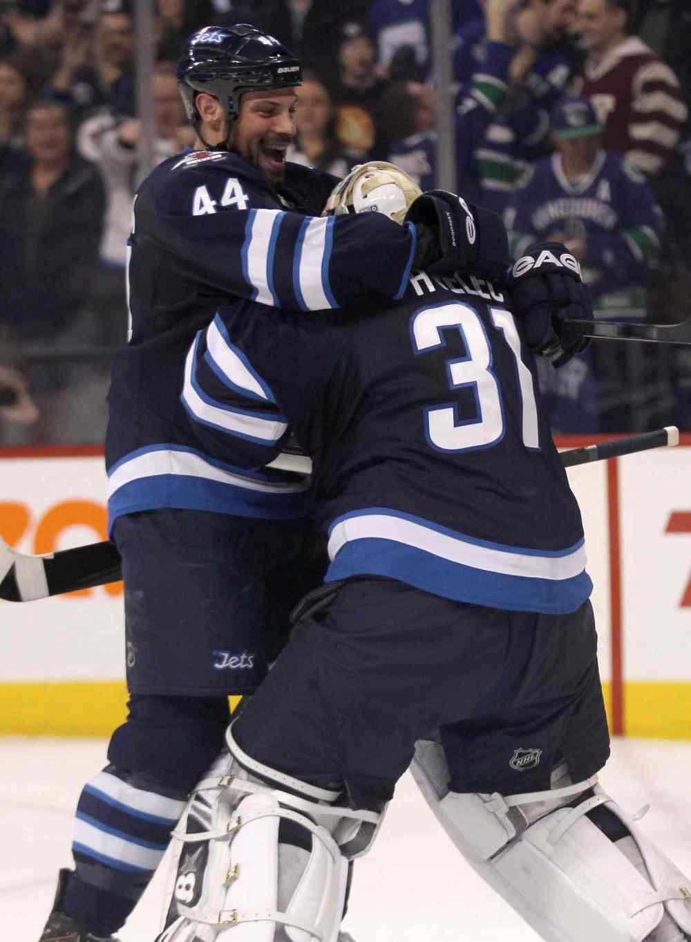 JOE BRYKSA / WINNIPEG FREE PRESS
Winnipeg Jets' Zach Bogosian celebrates win over the Vancouver Canucks with goaltender Ondrej Pavelec after the Jets beat the Canucks 4-3 Friday night.