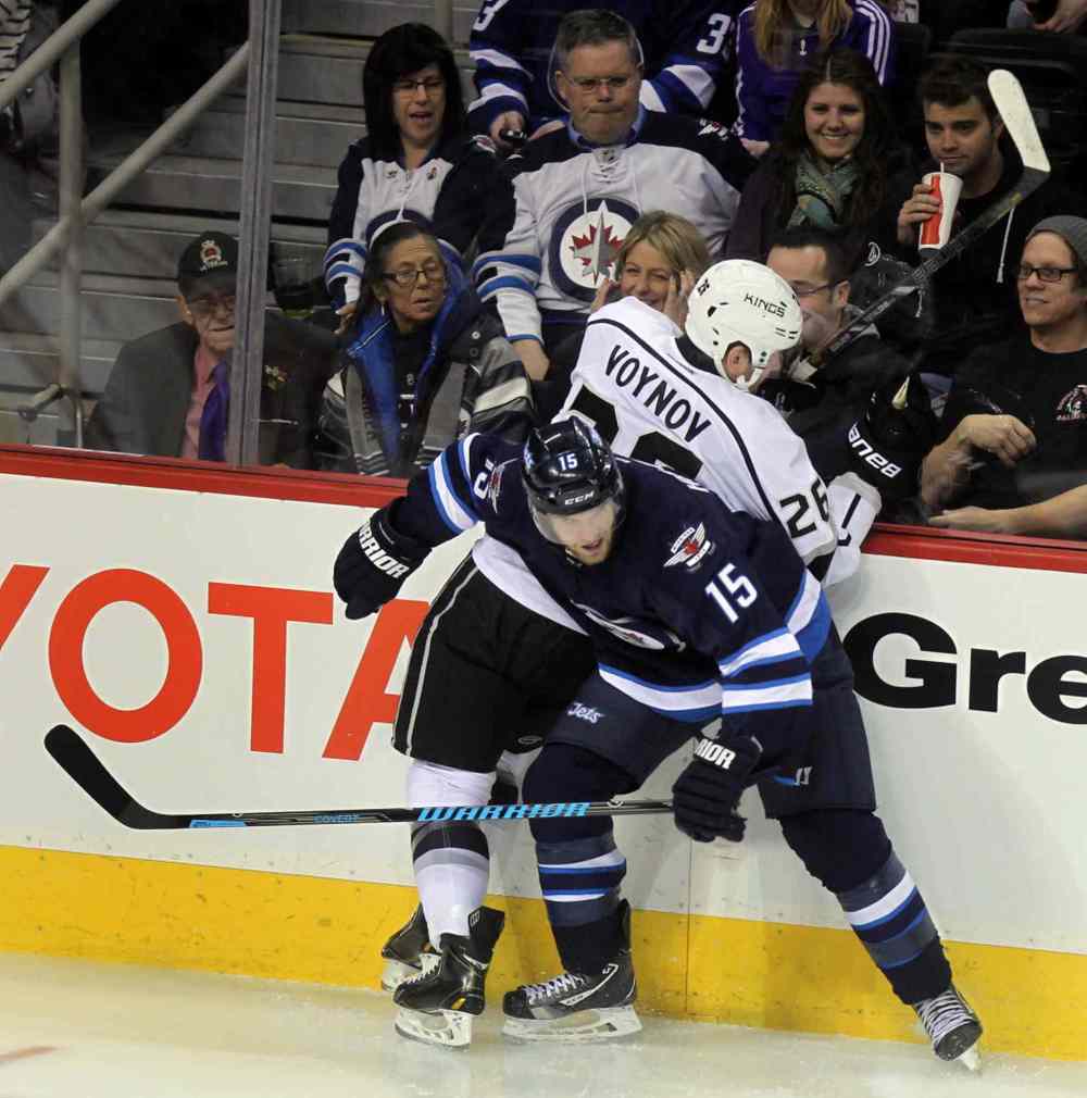 Phil Hossack / Winnipeg Free Press
Andrew Ladd corners Los Angeles King Slava Voynov in first period action at the MTS Center Thursday.