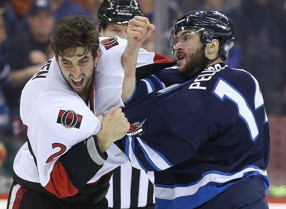 TREVOR HAGAN / WINNIPEG FREE PRESS
Ottawa Senators' Jared Cowen (2) fights Winnipeg Jets' Anthony Peluso (14) during the second period.