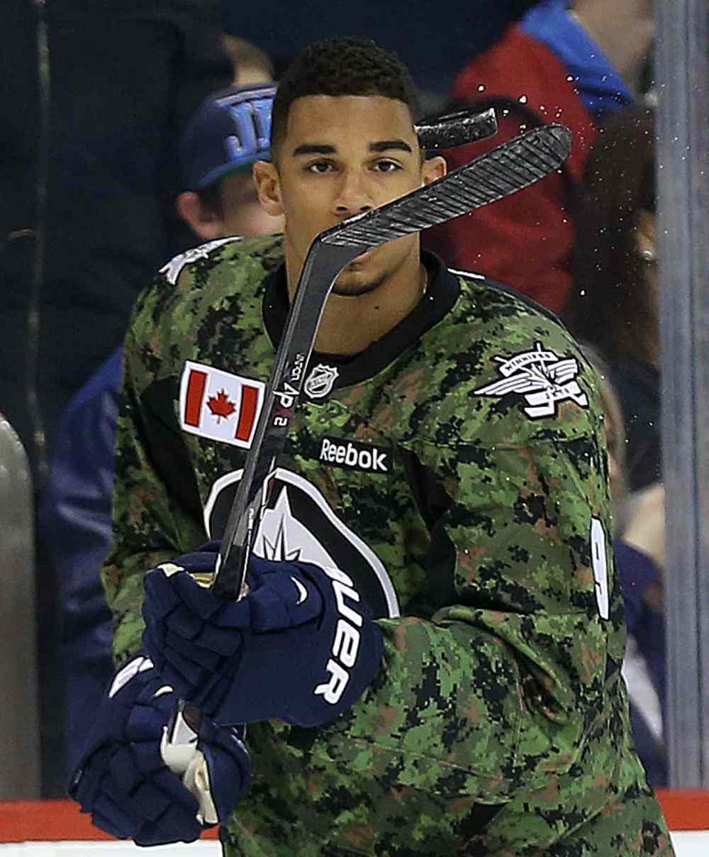 TREVOR HAGAN / WINNIPEG FREE PRESS
Winnipeg Jets' Evander Kane (9) juggles the puck during warmup while wearing a camouflage jersey on Military Appreciation day prior to the game against the Ottawa Senators Saturday.