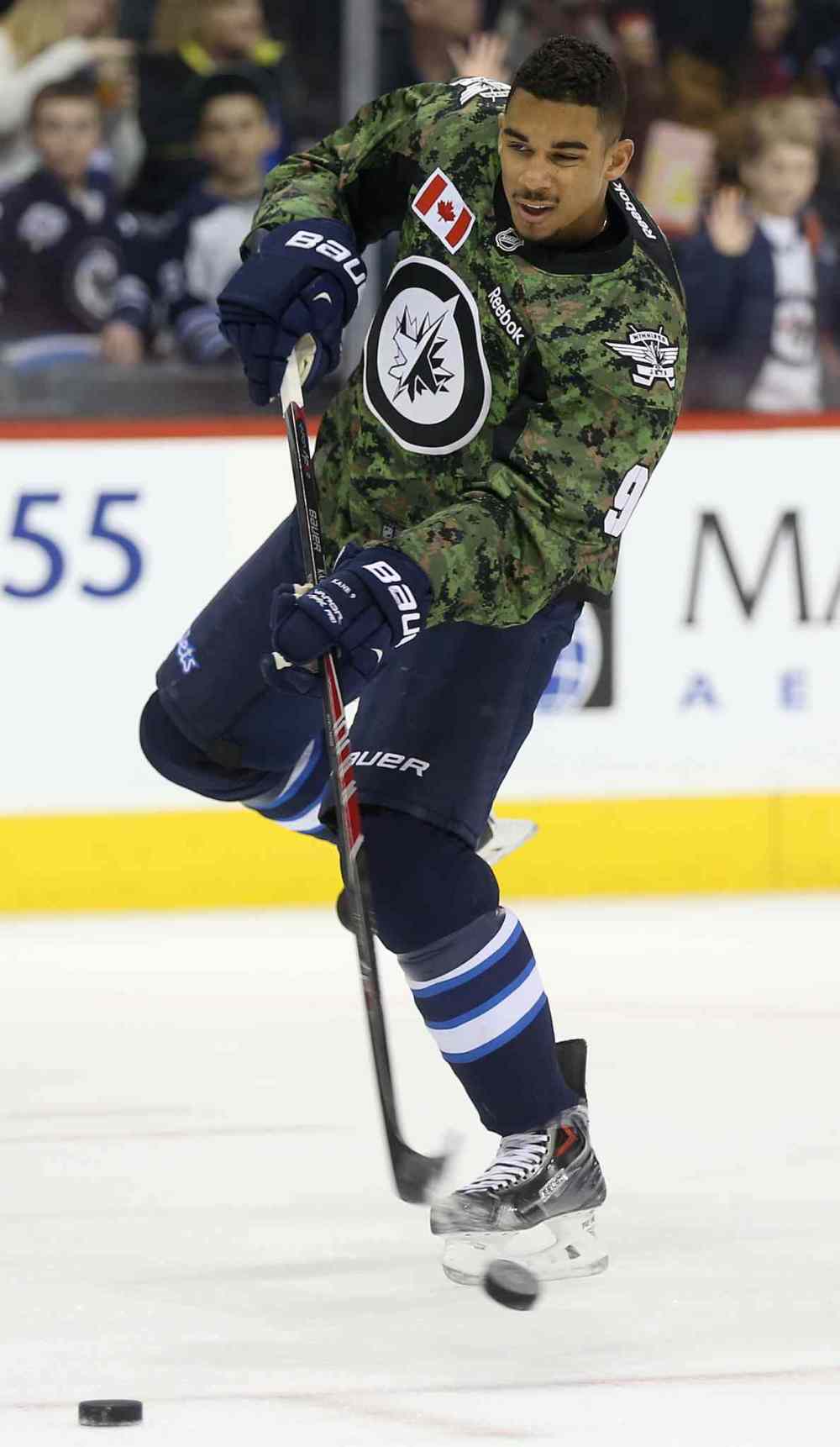 TREVOR HAGAN / WINNIPEG FREE PRESS
Winnipeg Jets' Evander Kane (9) fires a shot during warmup while wearing a camouflage jersey on Military Appreciation day prior to the game against the Ottawa Senators Saturday