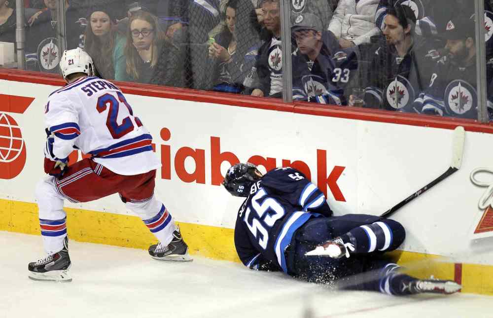 Phil Hossack / Winnipeg Free Press
New York Rangers Derek Stepan introduces Winnipeg Jets Mark Scheifele to the boards during third period.