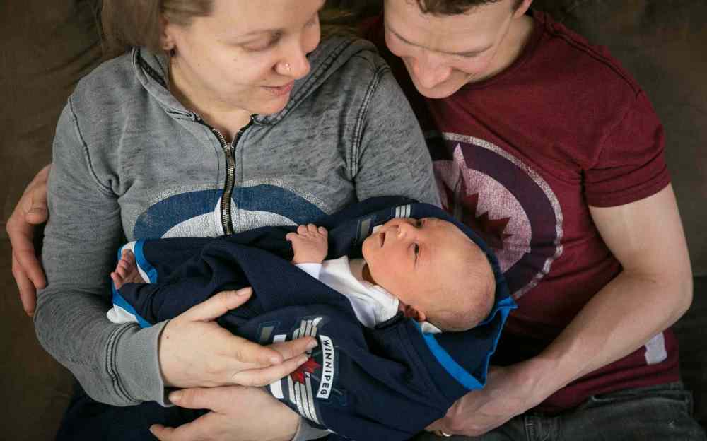 Melissa Tait / Winnipeg Free Press
Justine and Jeremy Welwood with their two-day-old baby boy Jett, born April 13. He's not just named after the Winnipeg Jets; his parents both liked the name.