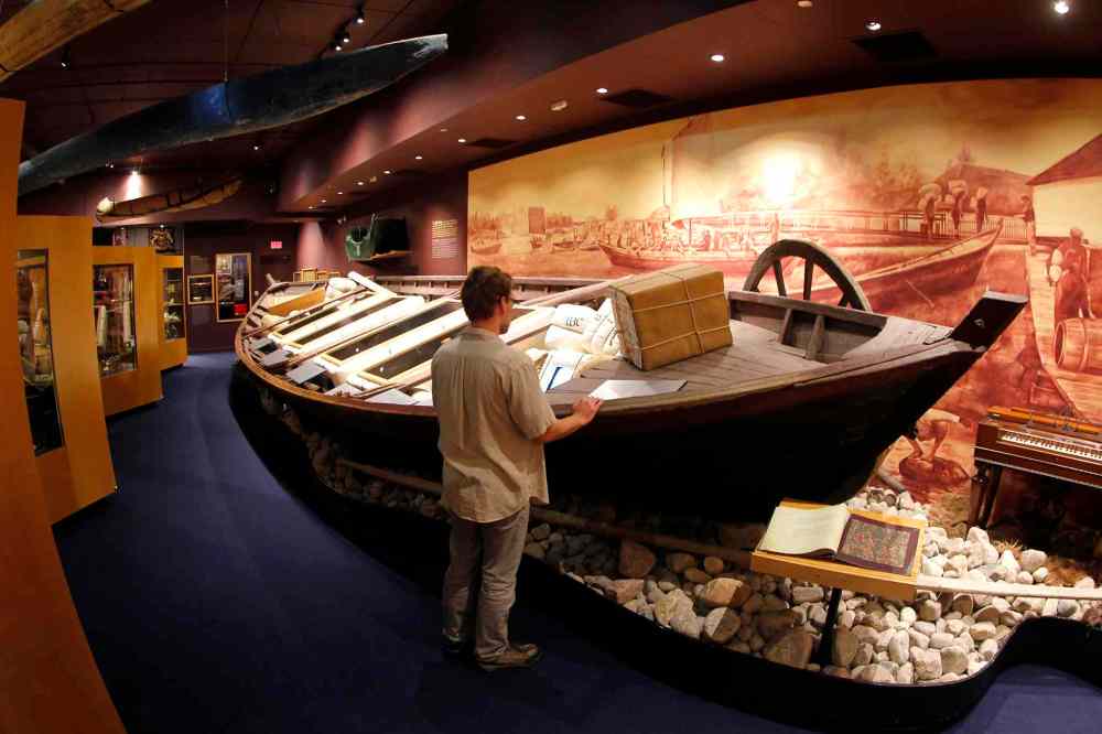 The Manitoba Museum. An old Hudson Bay boat on display. Staff member stands at the boat. BORIS MINKEVICH/WINNIPEG FREE PRESS