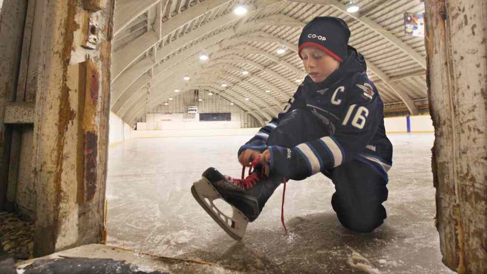 JOE BRYKSA / WINNIPEG FREE PRESS  Rayan Sprott gears up inside the Minto arena.