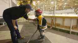 JOE BRYKSA / WINNIPEG FREE PRESS Rohan Pettinger with his father inside the arena after a long skate in Pierson, Man.