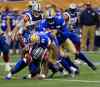 PHIL HOSSACK / WINNIPEG FREE PRESS -  Montreal Alouettes' receiver #23 Brandon Rutley goes down under apile of Blue Bombers led by #31 Maurice Leggett  then #3 Macho Harris and #91 Adrian Hubbard Wednesday at Investor's Field.  June 7, 2016.