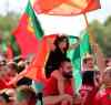 TREVOR HAGAN / WINNIPEG FREE PRESS Fans of the Portuguese soccer team celebrate on Sargent Avenue after their team defeated France in the Euro 2016 Final, Sunday, July 10, 2016.