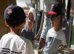 Jhase Farzyna (left) and Alex Beaufort-Bell look into a carnival mirror.