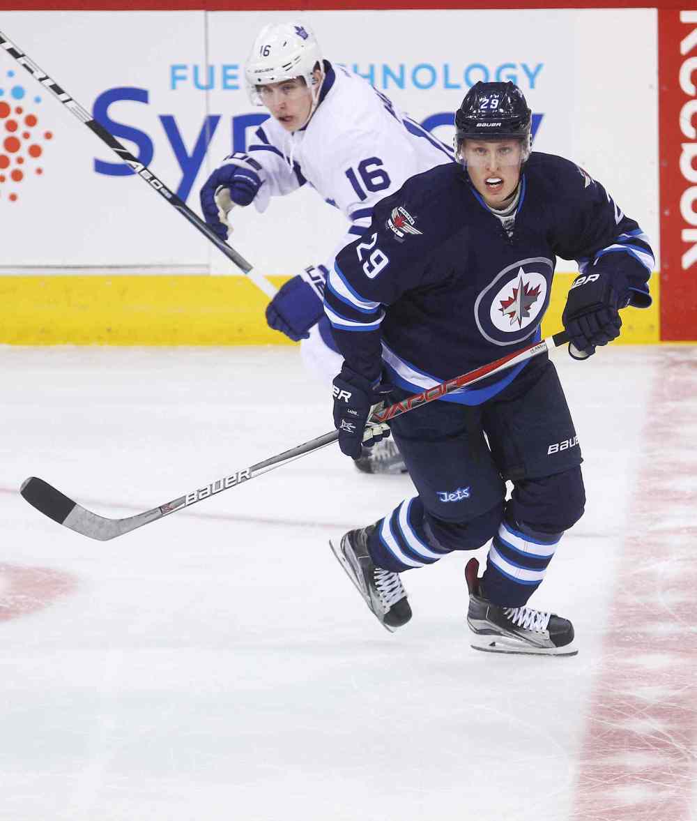 MIKE DEAL / WINNIPEG FREE PRESS
Winnipeg Jets Patrik Laine (29) and the Toronto Maple Leafs Mitchell Marner (16) during the game at the MTS Centre Wednesday evening.