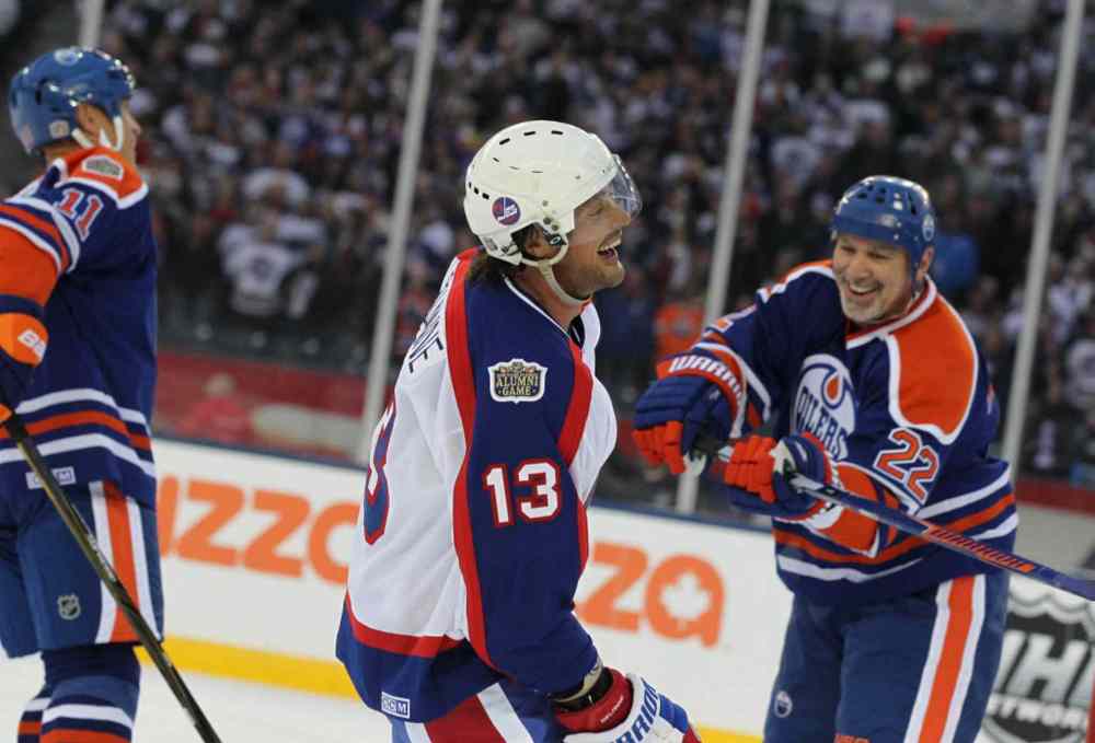 RUTH BONNEVILLE / WINNIPEG FREE PRESS
Teemu Selanne smiles as he celebrates at the end of the game after the Jets alumni won 6 - 5 against the Edmonton Oilers alumni team.
October 22, 2016