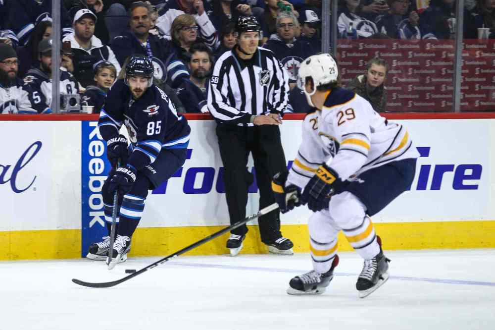 MIKE DEAL / WINNIPEG FREE PRESS
Winnipeg Jets' Mathieu Perreault (85) takes the puck over the blue line during play against the Buffalo Sabres' defenceman Jake McCabe (#29) Sunday afternoon at the MTS Centre.
