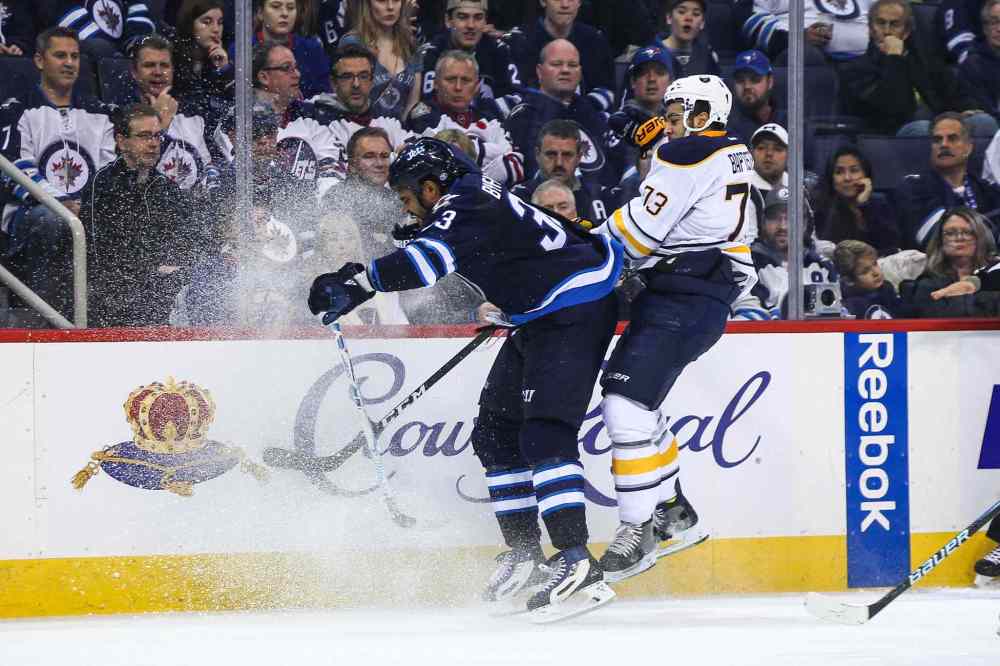 MIKE DEAL / WINNIPEG FREE PRESS
MIKE DEAL / WINNIPEG FREE PRESS
The Winnipeg Jets' Dustin Byfuglien (33) knocks Buffalo Sabres' forward Nicholas Baptiste (#73) off the puck during NHL game action Sunday afternoon at the MTS Centre.
161030 - Sunday October 30, 2016