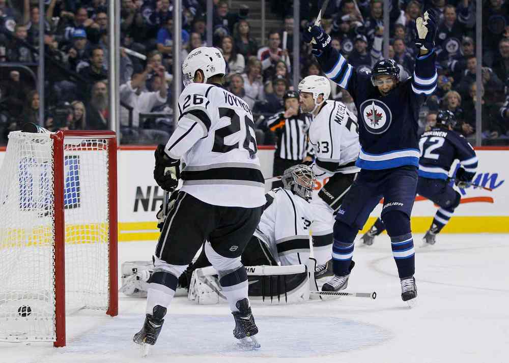 JOHN WOODS / THE CANADIAN PRESS
Winnipeg Jets' Evander Kane (9) and Olli Jokinen (12) celebrate Jokinen's goal against the Los Angeles Kings during the second period.