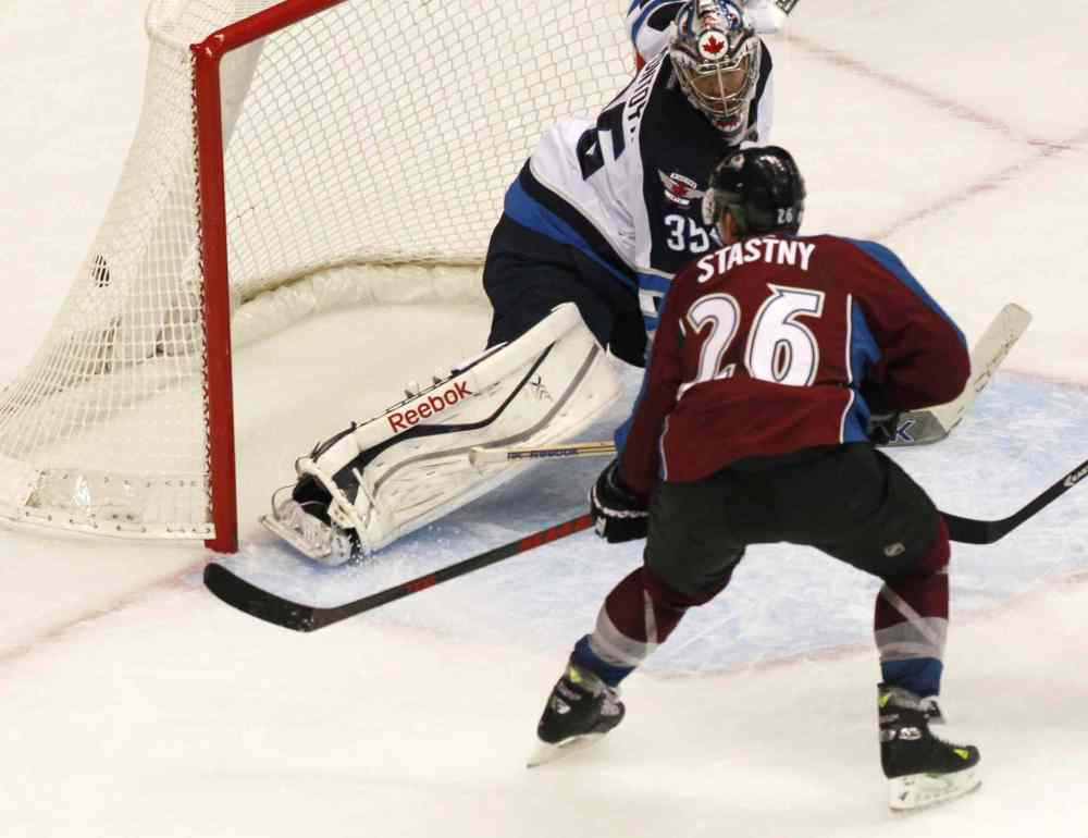 David Zalubowski / The Associated Press
Colorado Avalanche center Paul Stastny puts the puck in the net for the go-ahead goal in the third period.