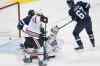 John Woods / The Canadian Press
Chicago Blackhawks' goaltender Corey Crawford (bottom) can't stop a shot from the point by Winnipeg Jets defenceman Toby Enstrom as Matt Halishchuk (15) and Michael Frolik (67) of the Jets and Hawks' Nick Leddy (8) look for the rebound during the first period.