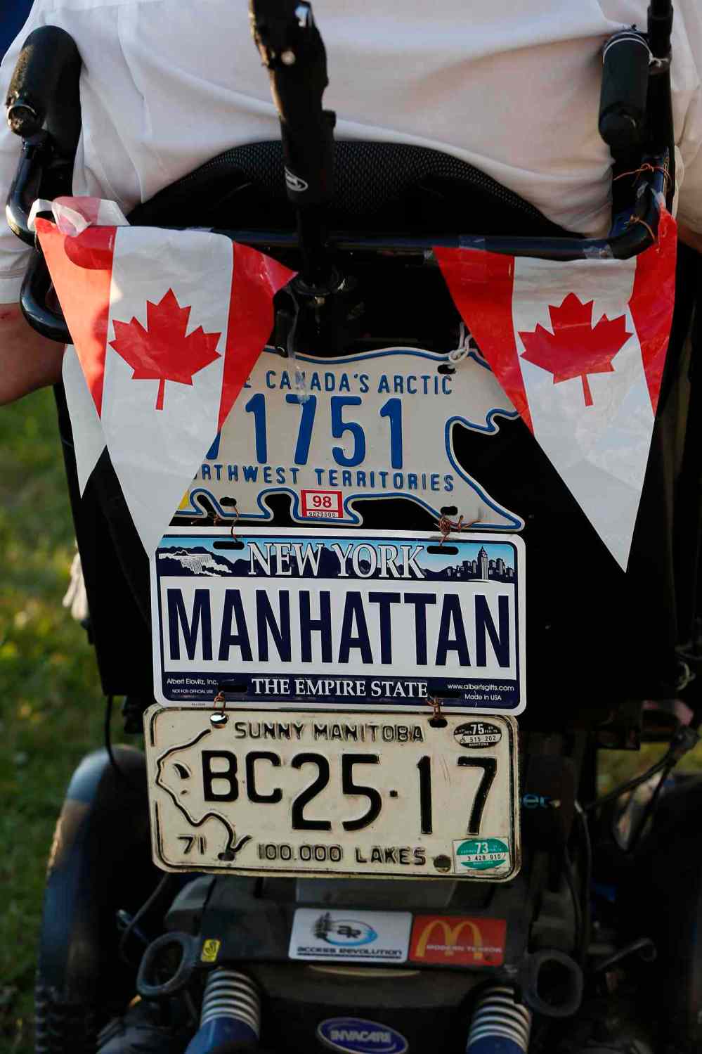 JOHN WOODS / WINNIPEG FREE PRESS
This wheelchair shows off its travel cred during the final day of the Folk Fest.