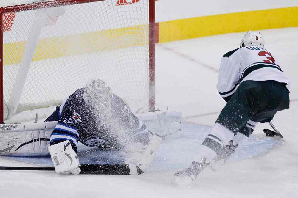 JOHN WOODS / THE CANADIAN PRESS
Minnesota Wild's Charlie Coyle scores on his shootout attempt for the win.