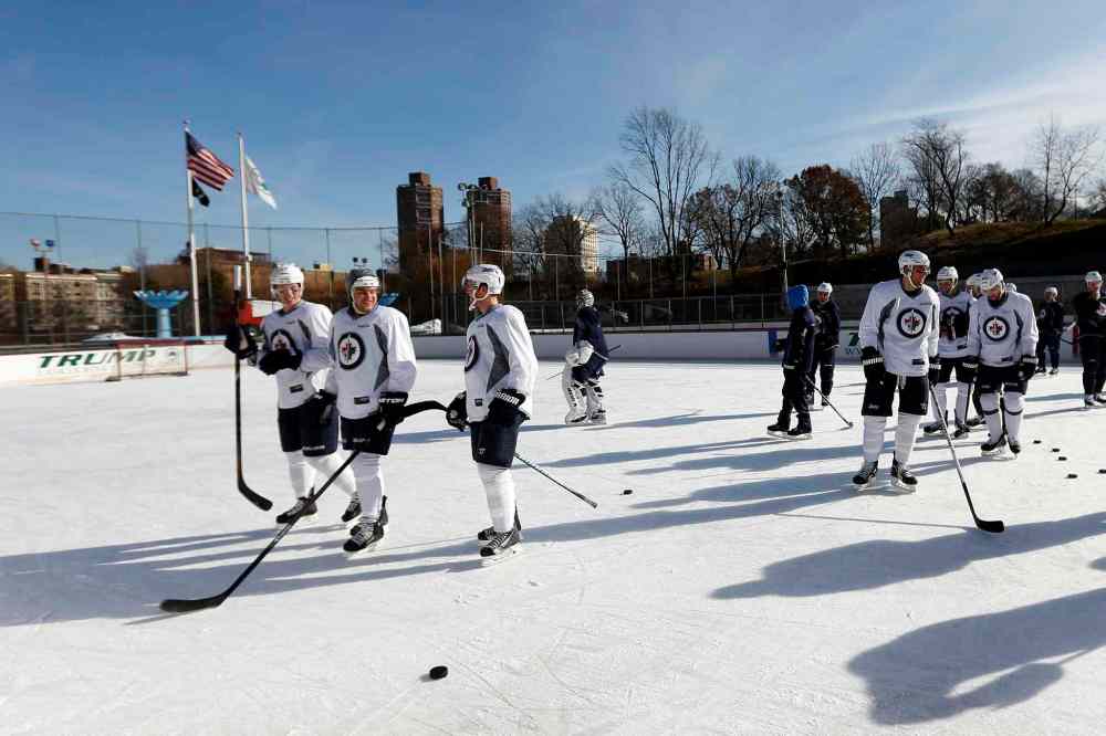 Jason DeCrow / The Associated Press
The skies were clear and sunny as the Jets ran through drills.