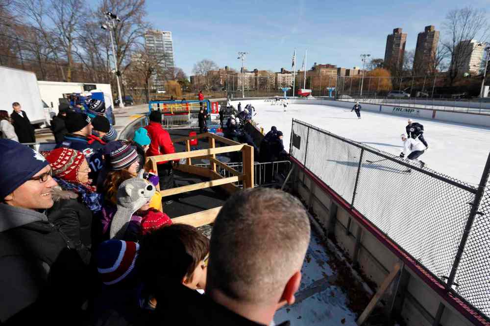 Jason DeCrow / The Associated Press
Fans watch as the Winnipeg Jets practice outside.