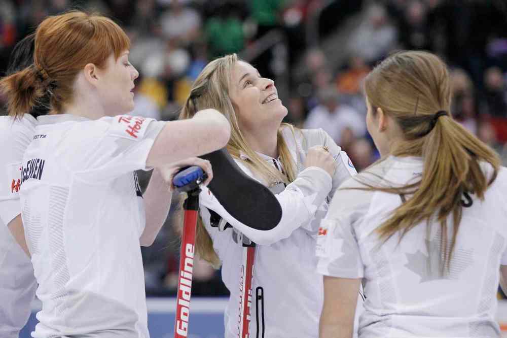 John Woods / The Canadian Press
Skip Jennifer Jones (centre right) and her team (from left) Jill Officer, Dawn McEwen and Kaitlyn Lawes watch the replay of her three-point shot in the second end.