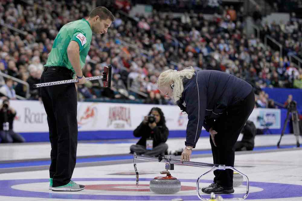 John Woods / The Canadian Press
Skip John Morris watches as an official measures stones in the fifth end.