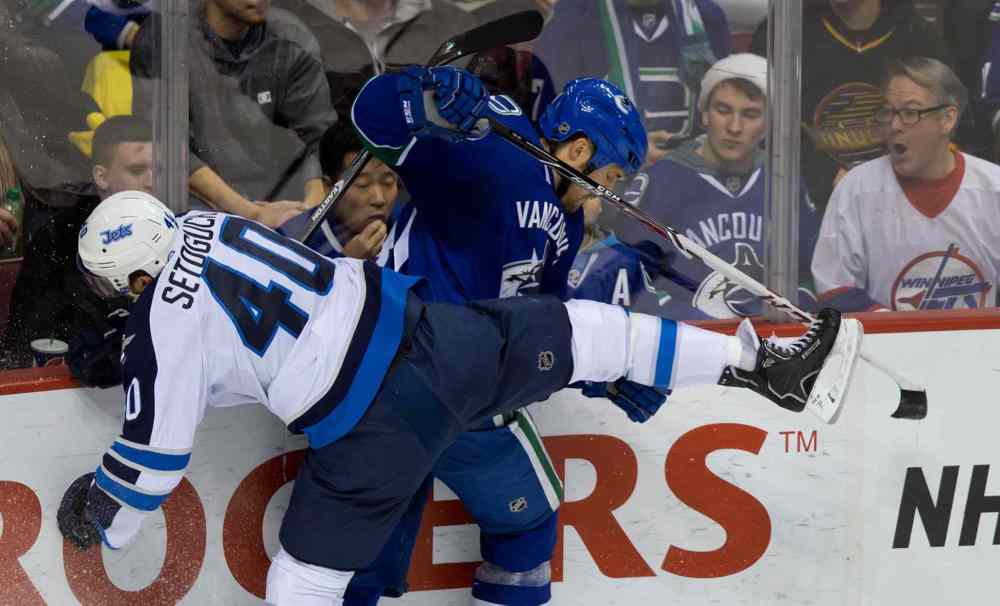 DARRYL DYCK / THE CANADIAN PRESS
Winnipeg Jets forward Devin Setoguchi (left) and Vancouver Canucks' Andrew Alberts collide during the second period.