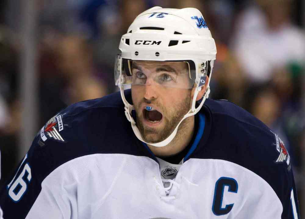 DARRYL DYCK / THE CANADIAN PRESS
Winnipeg Jets captain Andrew Ladd lines up for a faceoff during the first period.