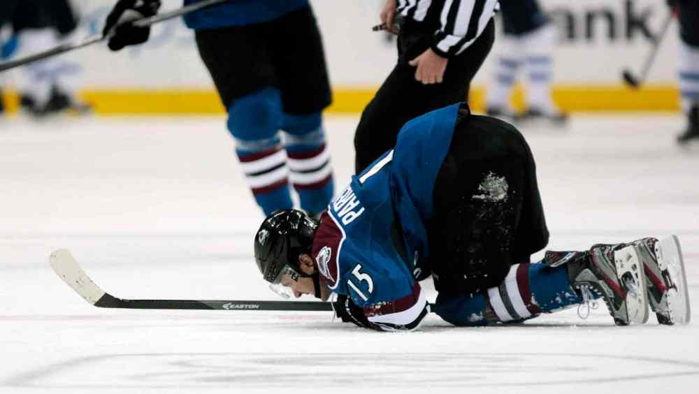Joe Mahoney / The Associated Press
Colorado Avalanche winger P.A. Parenteau kneels on the ice after after getting hurt during the second period. He left the game and did not return.
