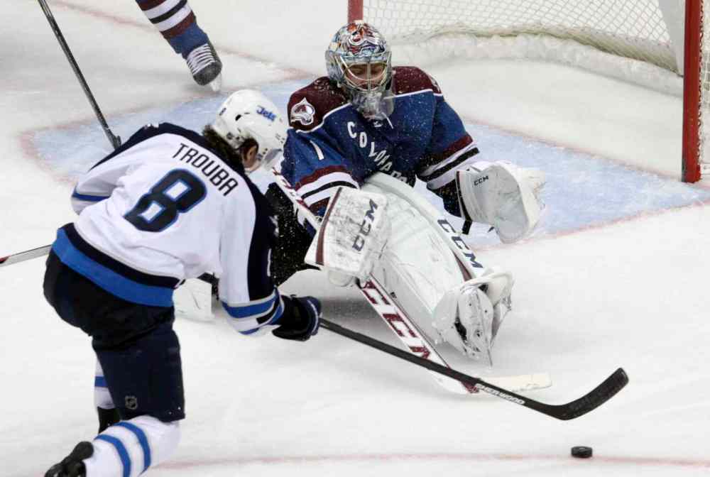 Joe Mahoney / The Associated Press
Colorado Avalanche goalie Semyon Varlamov (right) sets up against Winnipeg Jets defenceman Jacob Trouba during the third period.