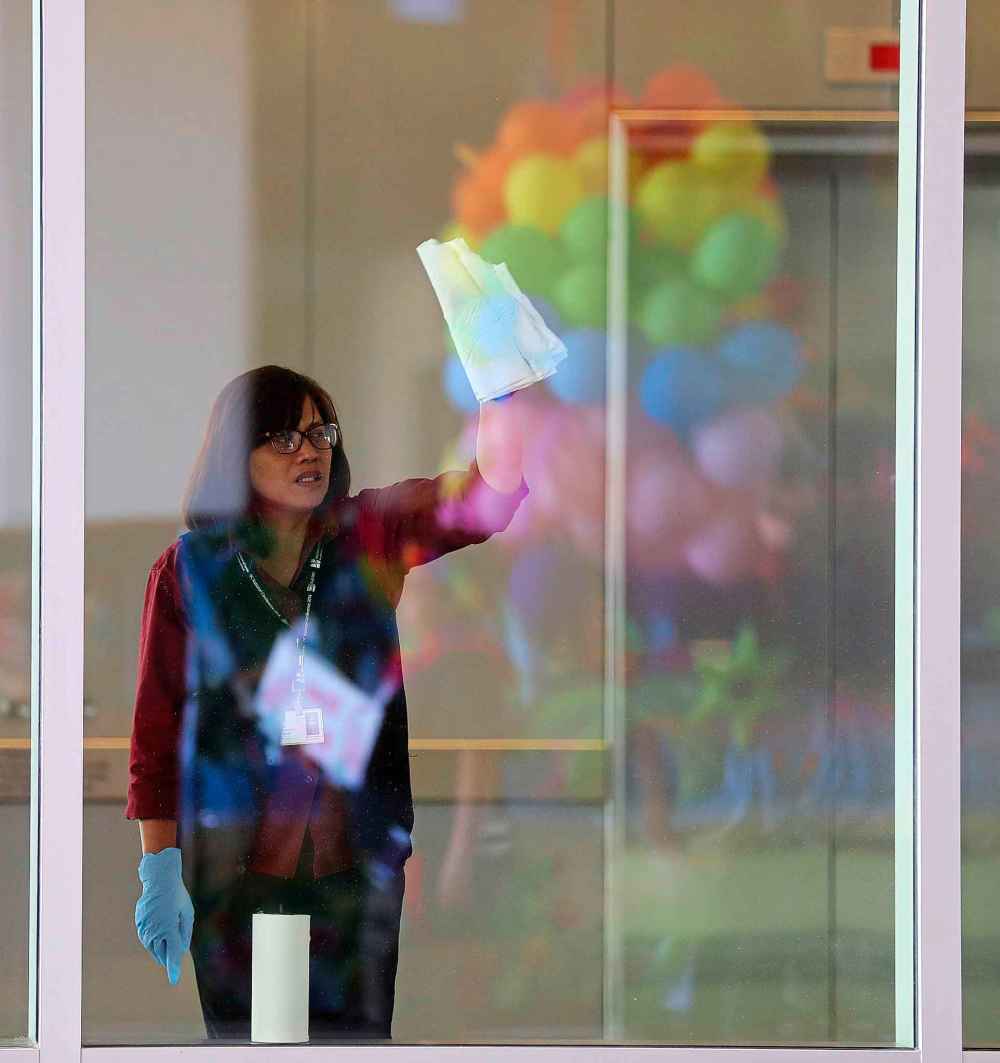 Window washers inside the convention centre watching the Pride Parade, Sunday, June 3, 2018.
