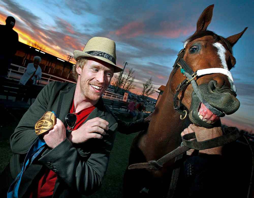 MAY 2011: Jon Montgomery shows off his Olympic gold medal to his namesake