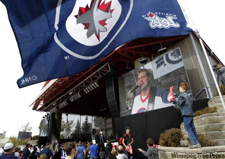 The crowd enjoys Doc Walker performing at the Family Fan Zone event at The Forks Sunday that also featured Quinzy, Keith and Renee and the Hockey Night in Canada game featuring The Winnipeg Jets season-opener on large screens. (Wayne Glowacki / Winnipeg Free Press)