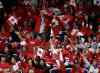 Frank Gunn / The Canadian Press
Fans hold up Canadian flags at the IIHF World Junior Hockey Championship game again the United States in Malmo, Sweden on Tuesday, December 31, 2013.