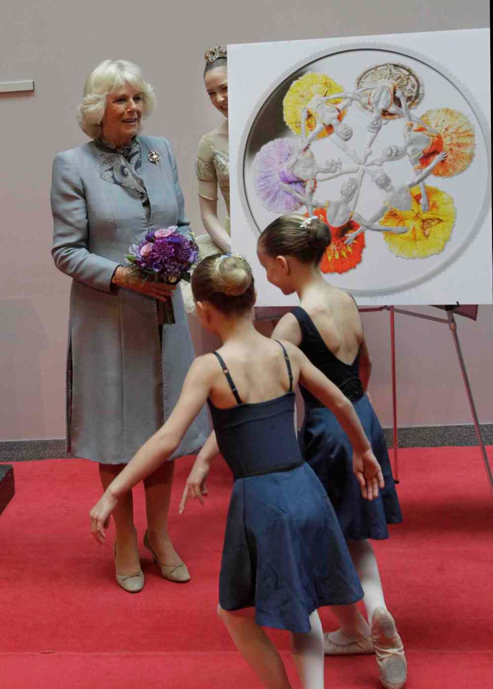 Wayne Glowacki / Winnipeg Free Press
Camilla, Duchess of Cornwall received flowers from young dancers Ava Skromeda, left and Lynea Turner after she helped to unveil the new silver collector coin to commemorate the 75th anniversary of Canada's Royal Winnipeg Ballet. Wednesday morning.