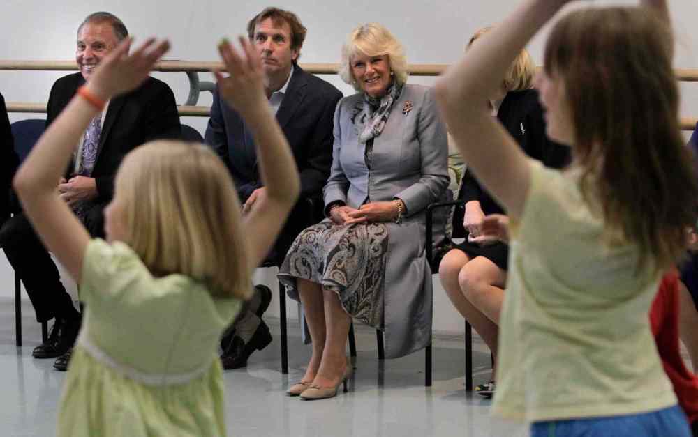Wayne Glowacki / Winnipeg Free Press
From left, Ron Lemieux, MLA and Minister of Tourism, Royal Winnipeg Ballet Artistic Director Andre Lewis and Camilla, Duchess of Cornwall watch an RWB outreach movement workshop with children from Art City.